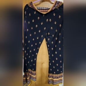 XL black and gold print stretch pants